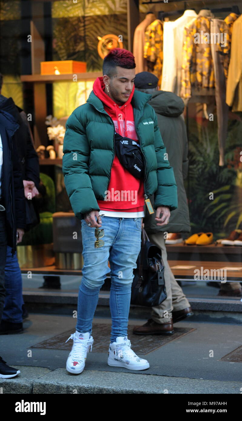 Milan, Sfera Ebbasta walks in the center The famous rapper SFERA EBBASTA  surprised to walk through the streets of the center. Here he is with  friends walking in Via Montenapoleone Stock Photo -