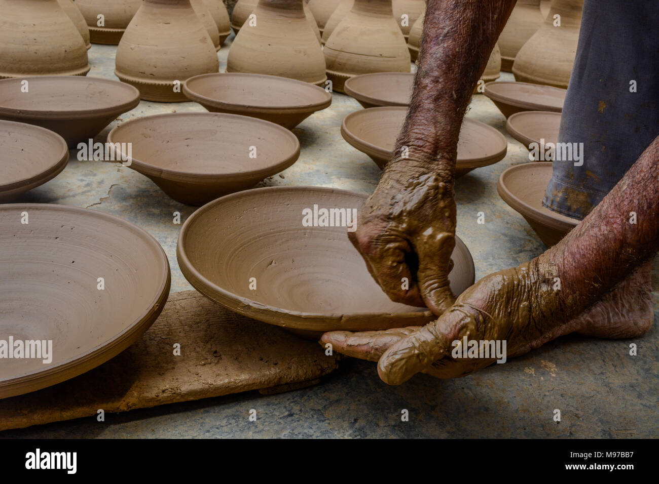 Kashmiri potter earthen pots at his in the outskirts of