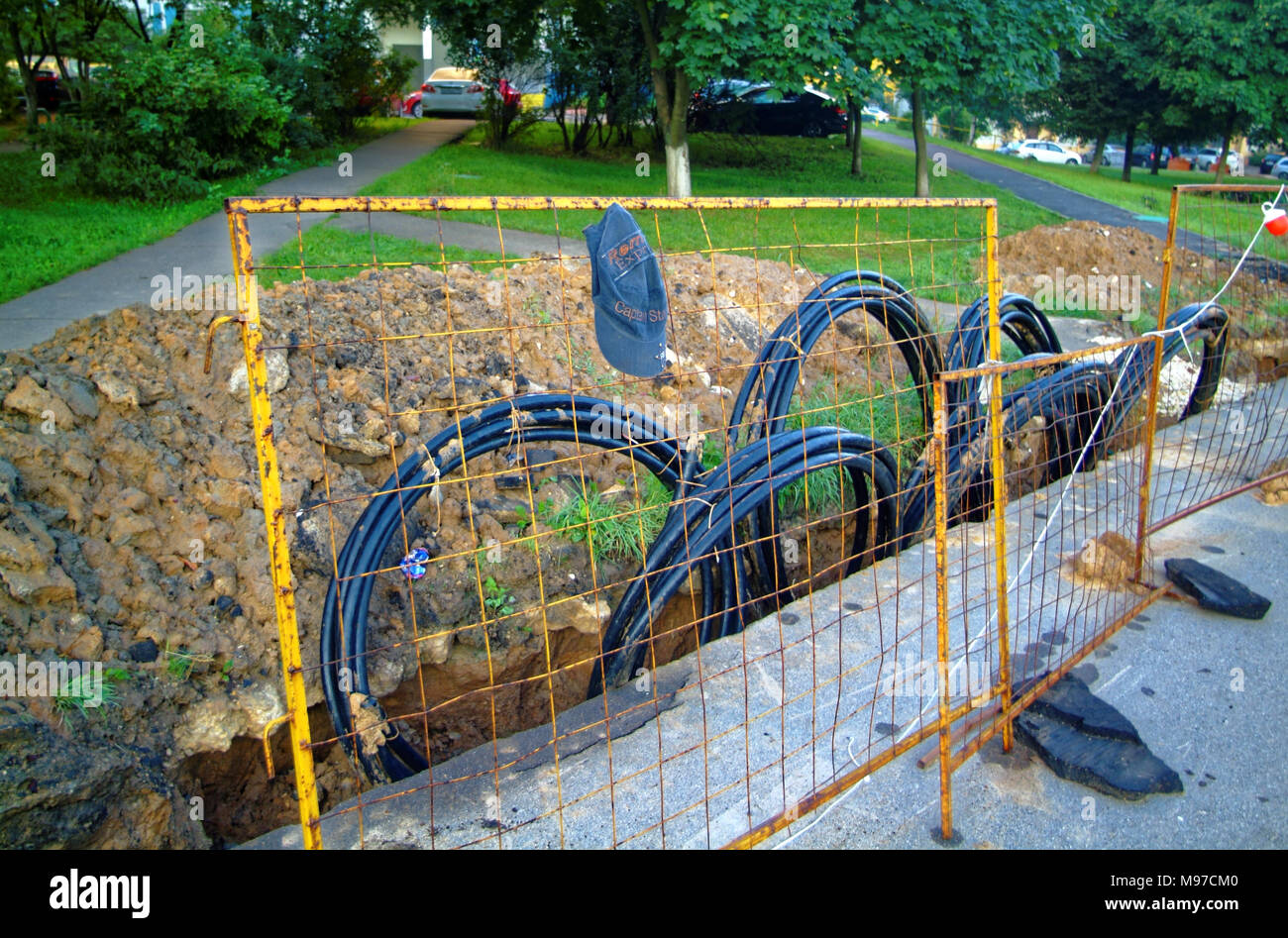repair trench with fence in the morning in Moscow Stock Photo