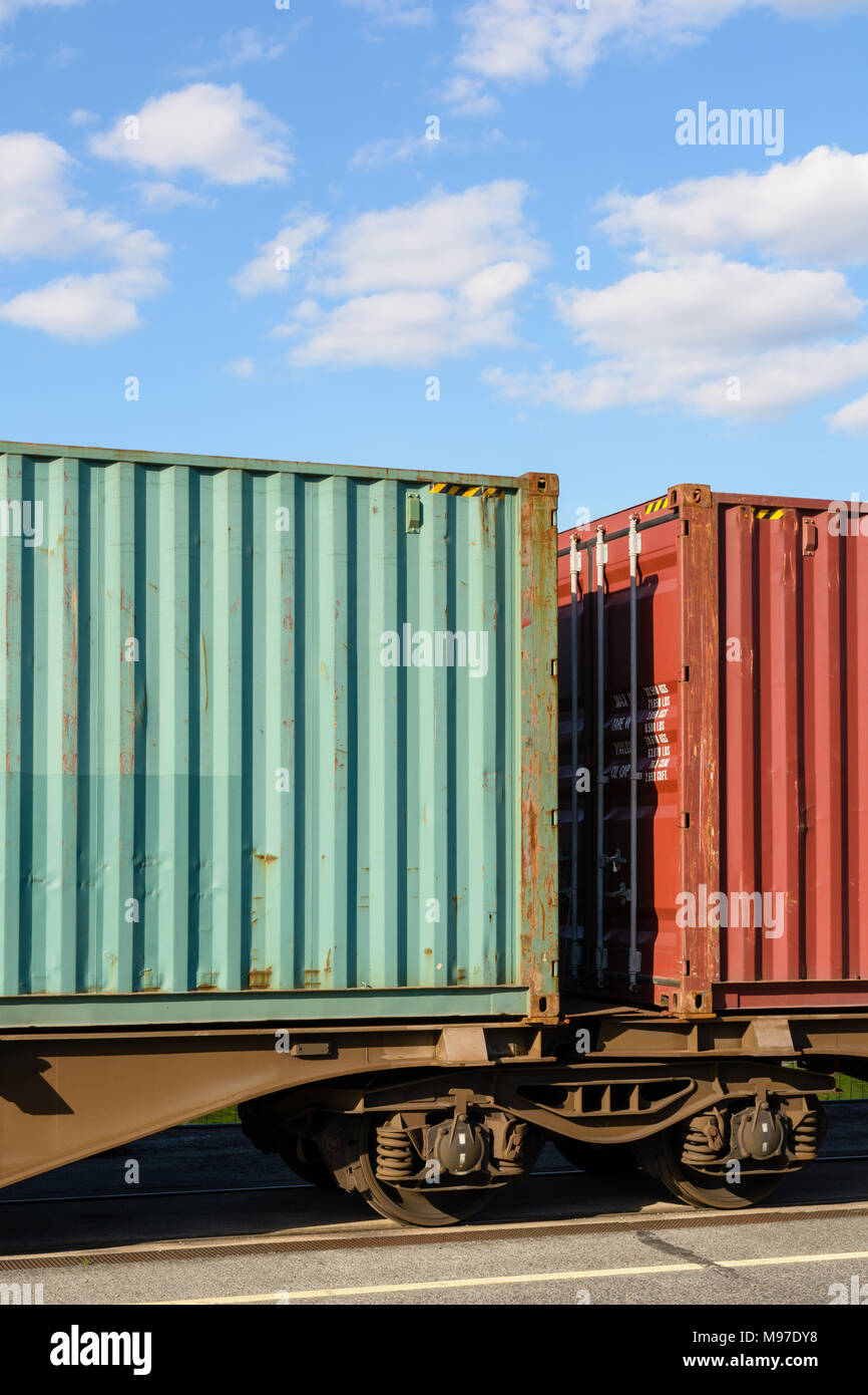 Two containers on a flat car train parked in a shipping yard in the region of Paris, France. Stock Photo