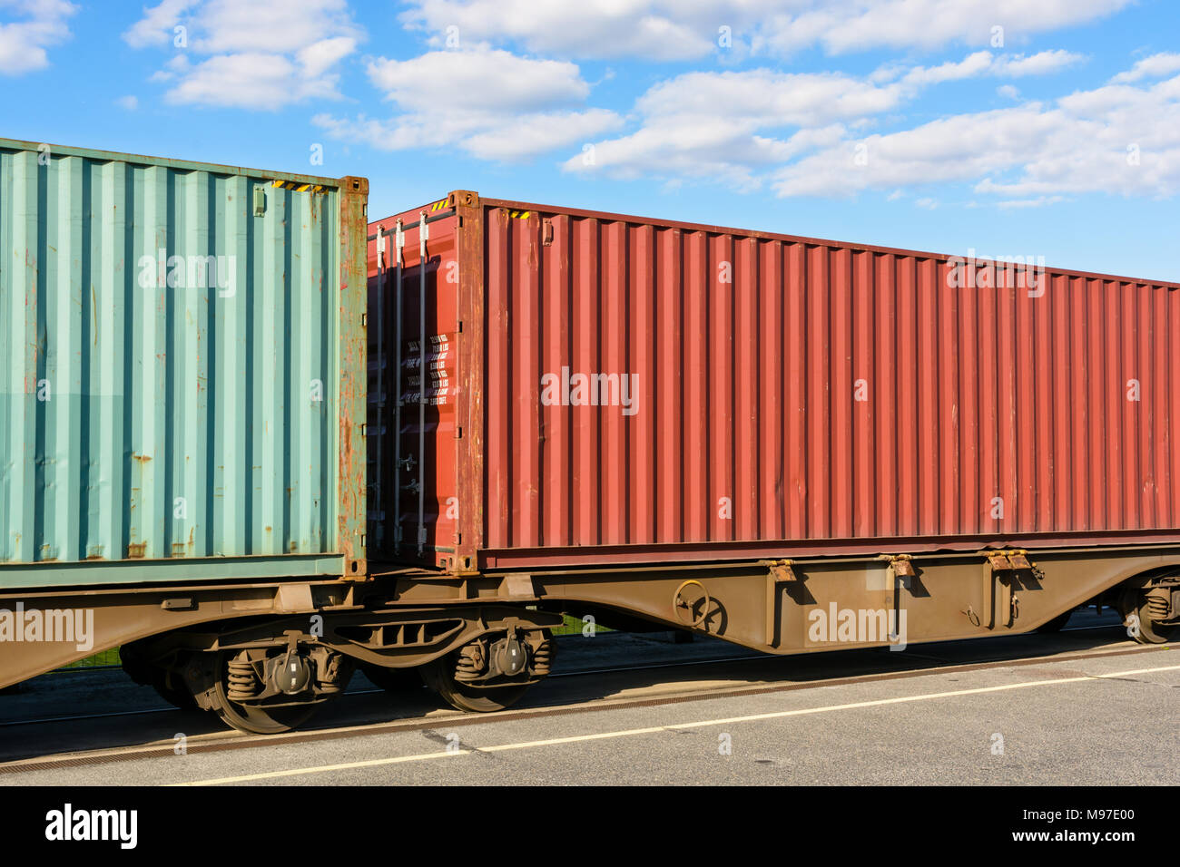 Two containers on a flat car train parked in a shipping yard in the suburbs of Paris, France. Stock Photo