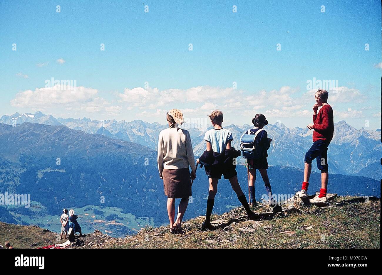 Jerzens, Austria - summer 1966: A family on holidays in Austria. Panoramic view of Jerzens and the Stubai mountains. Stock Photo