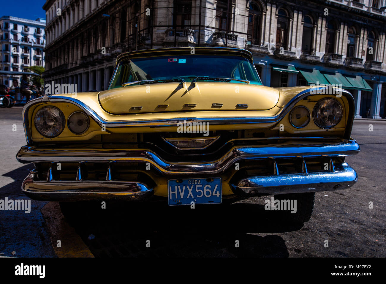 A 1958 classic Dodge Coronet waits for customer in a square in Havana, Cuba. Stock Photo