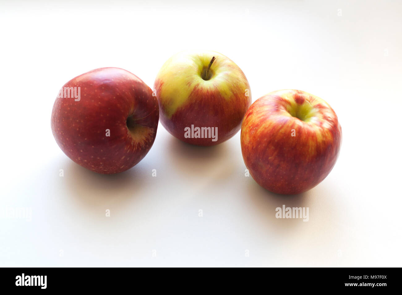 Three ripe red apples isolated on white background Stock Photo
