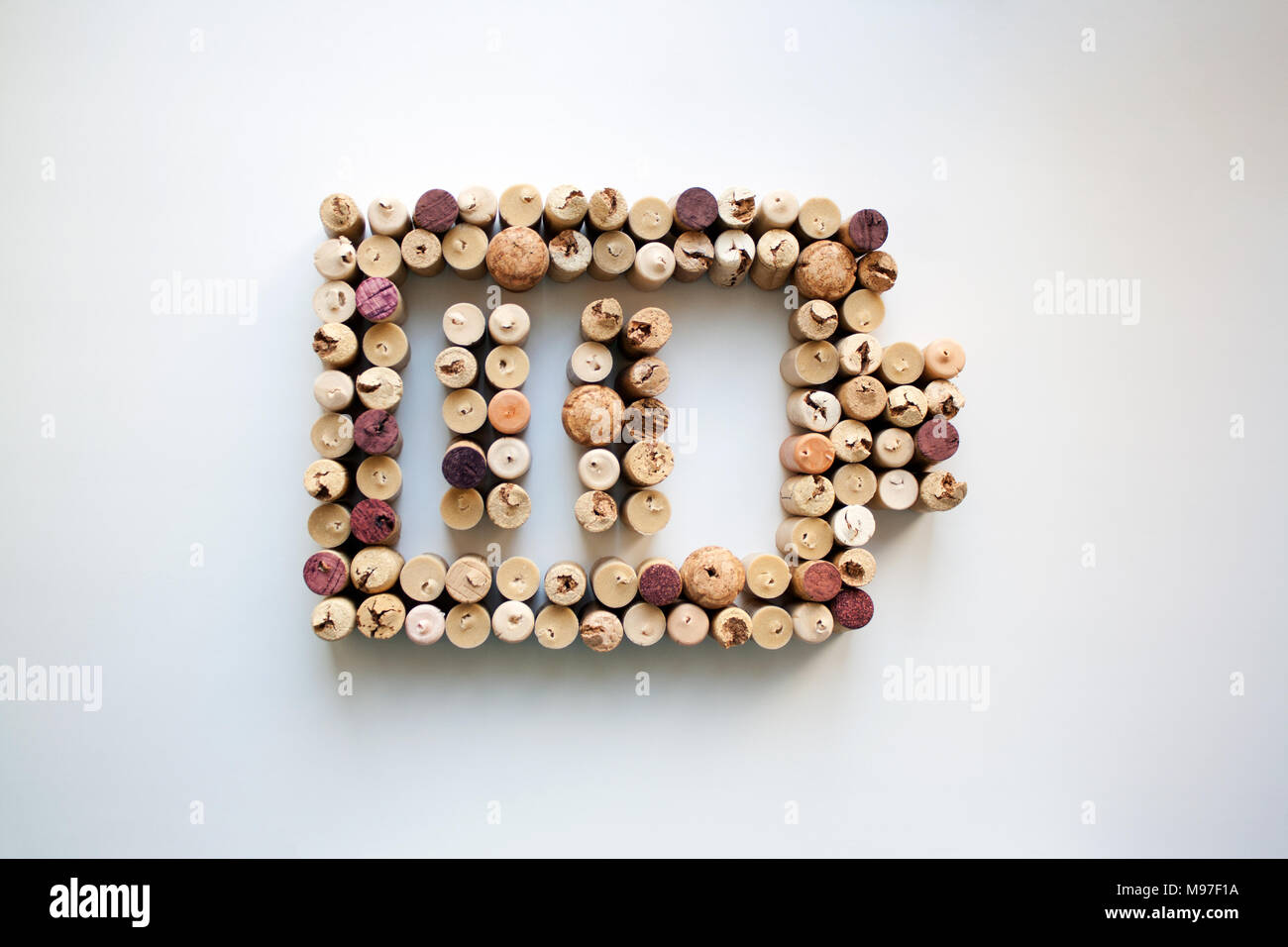 Wine corks battery charge level abstract composition isolated on white from a high angle view Stock Photo