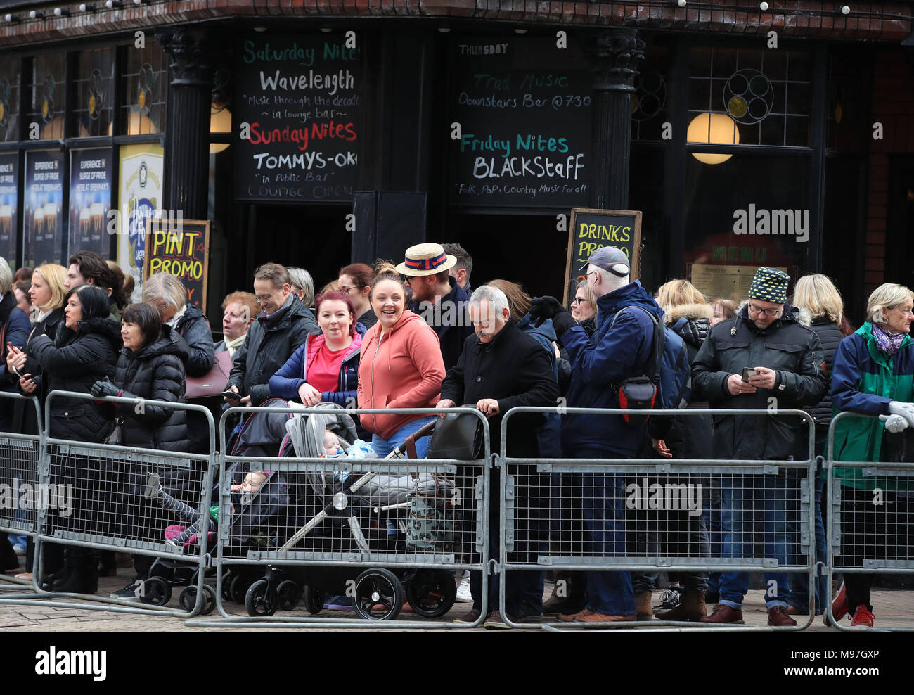 Crowds wait for Prince Harry and Meghan Markle to arrive for a walkabout in Belfast City centre where they visit the Crown Bar and learn from National Trust representatives about the pub's heritage, and meet bar staff, local comedians and musicians. Stock Photo