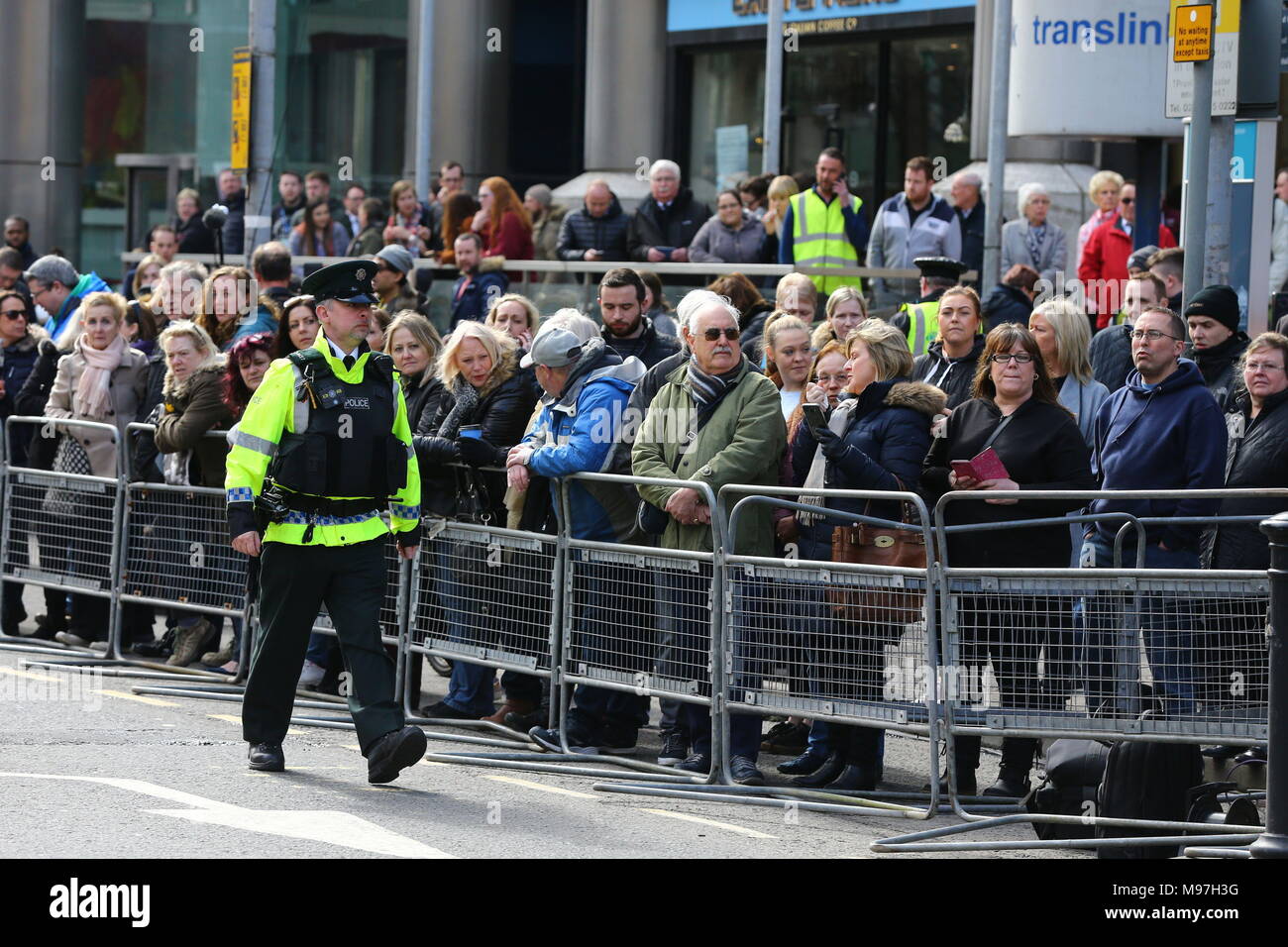 Crowds wait for Prince Harry and Meghan Markle to arrive for a walkabout in Belfast City centre where they will visit the Crown Bar and learn from National Trust representatives about the pub's heritage, and meet bar staff, local comedians and musicians. Stock Photo