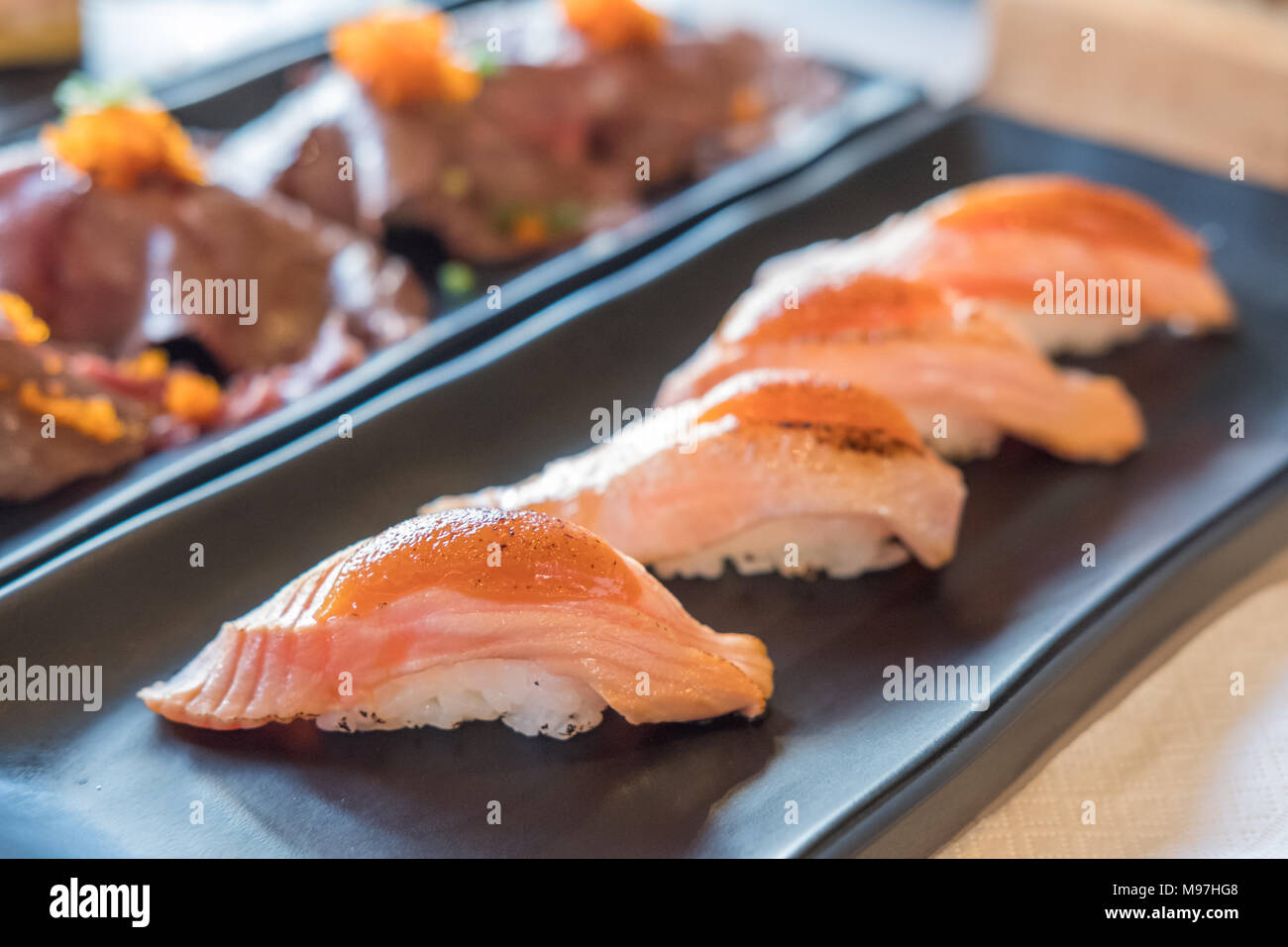Set of Salmon aburi sushi with saikyo sauce on plate Stock Photo Alamy