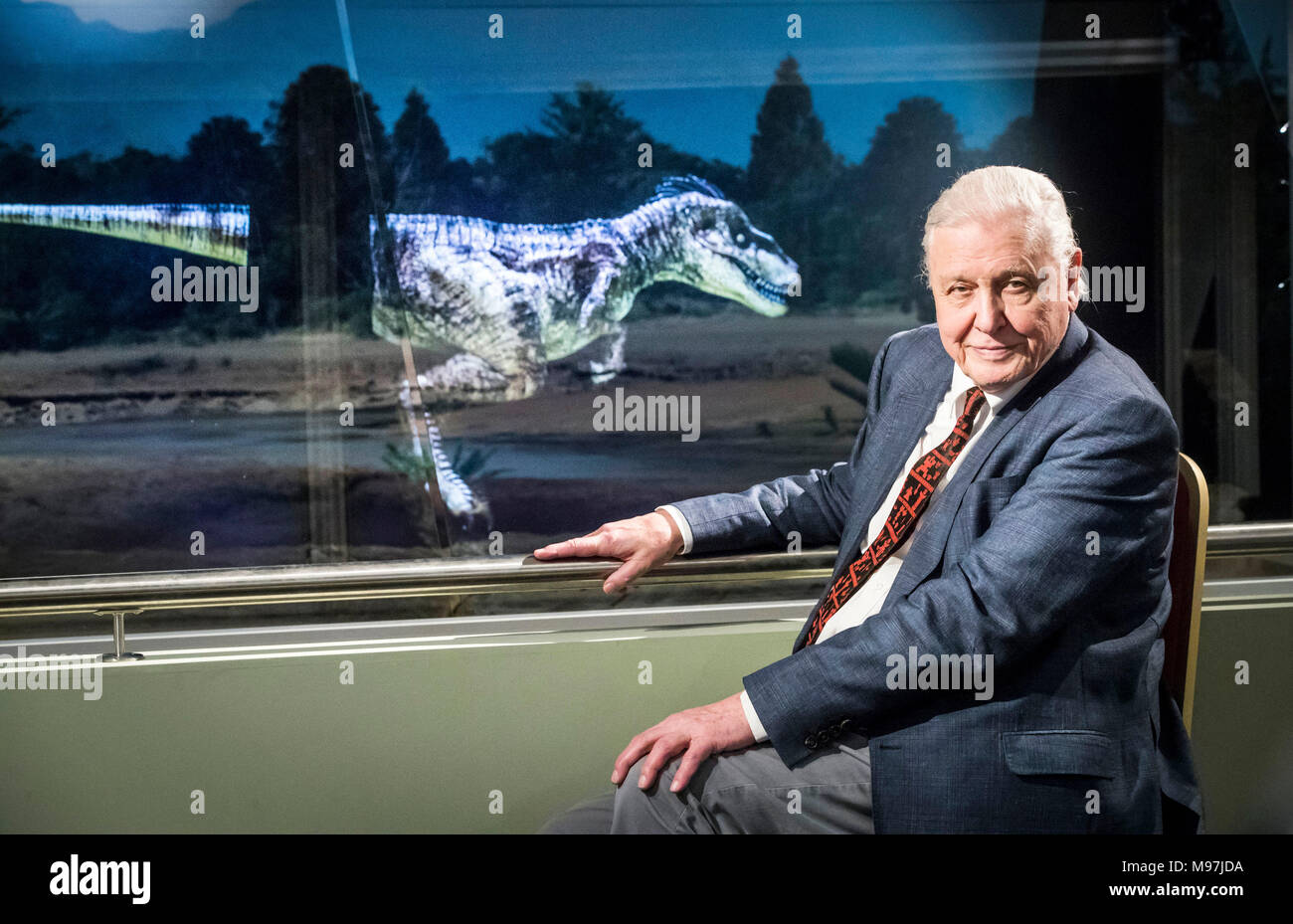 Sir David Attenborough is pictured with an animated, computer generated, Theropod dinosaur as he officially opens Yorkshire's Jurassic World at the Yorkshire Museum in York. Stock Photo