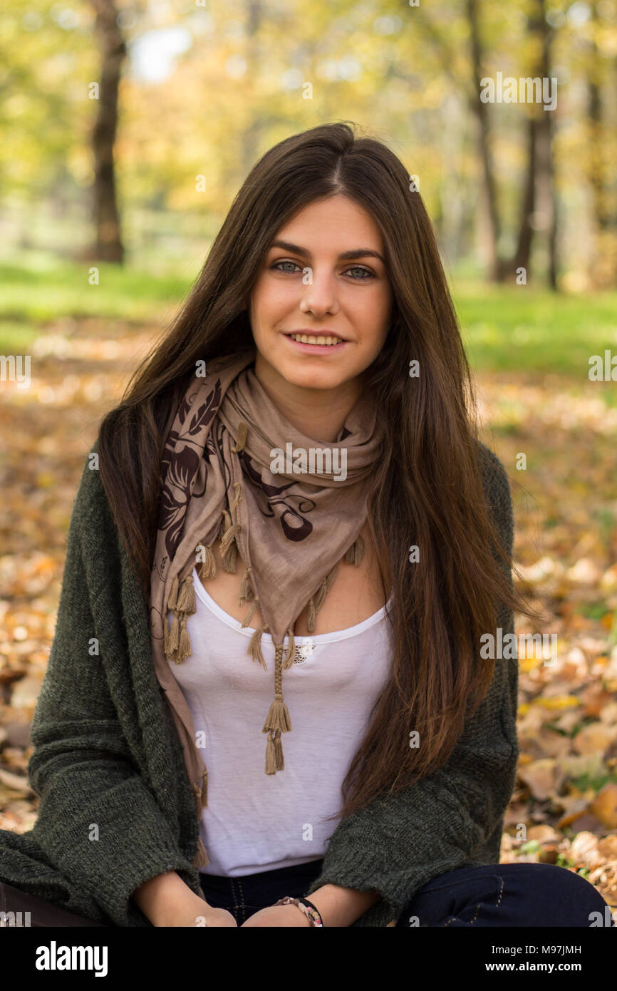 White Girl With Blue Eyes Posing In The Forest In Autumn Stock