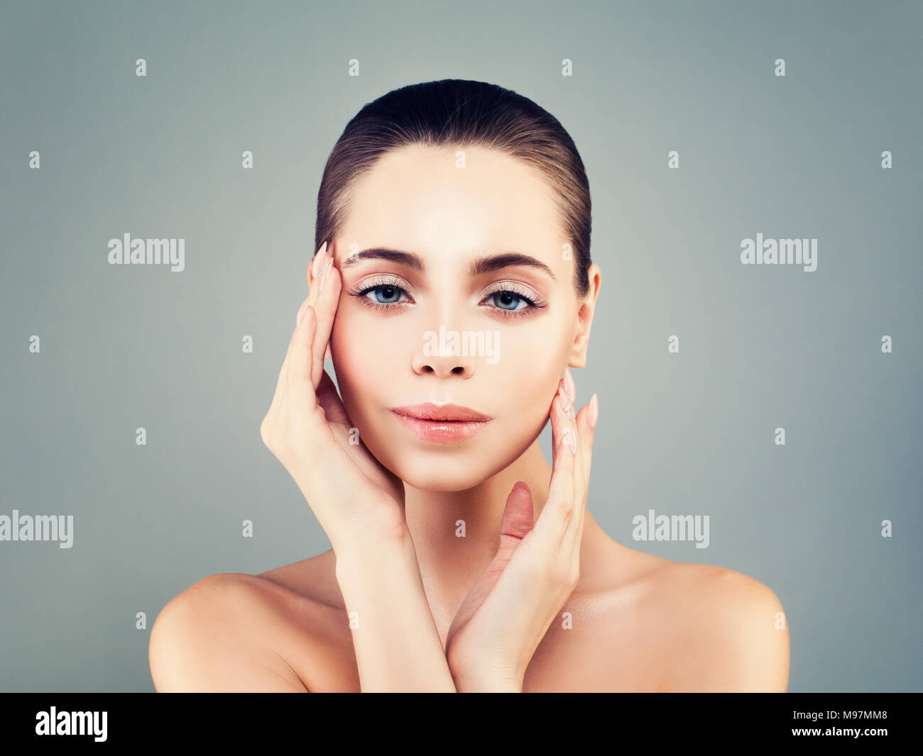Beauty Spa Woman Portrait. Beautiful Girl Touching her Face, Skincare, Facial Treatment and Cosmetology Concept Stock Photo