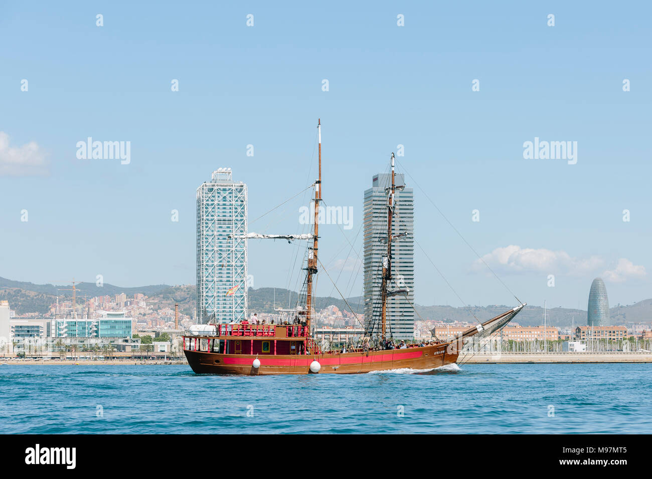 Boats sailing infront of the Barcelona coast, Catalonia, Spain Stock Photo