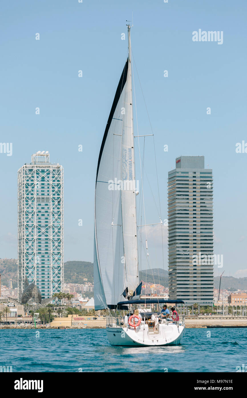 Two boats sailing infront of the Barcelona coast, Catalonia, Spain Stock Photo