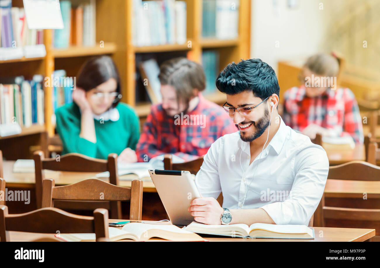 Student in the Library with Tablet PC Stock Photo