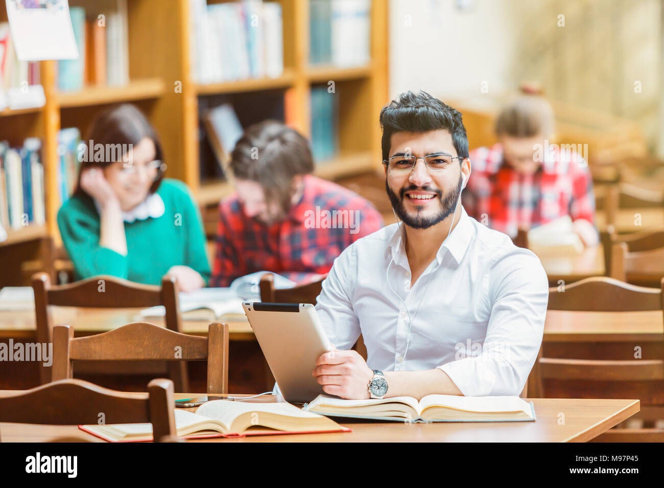 Student in the Library with Tablet PC Stock Photo