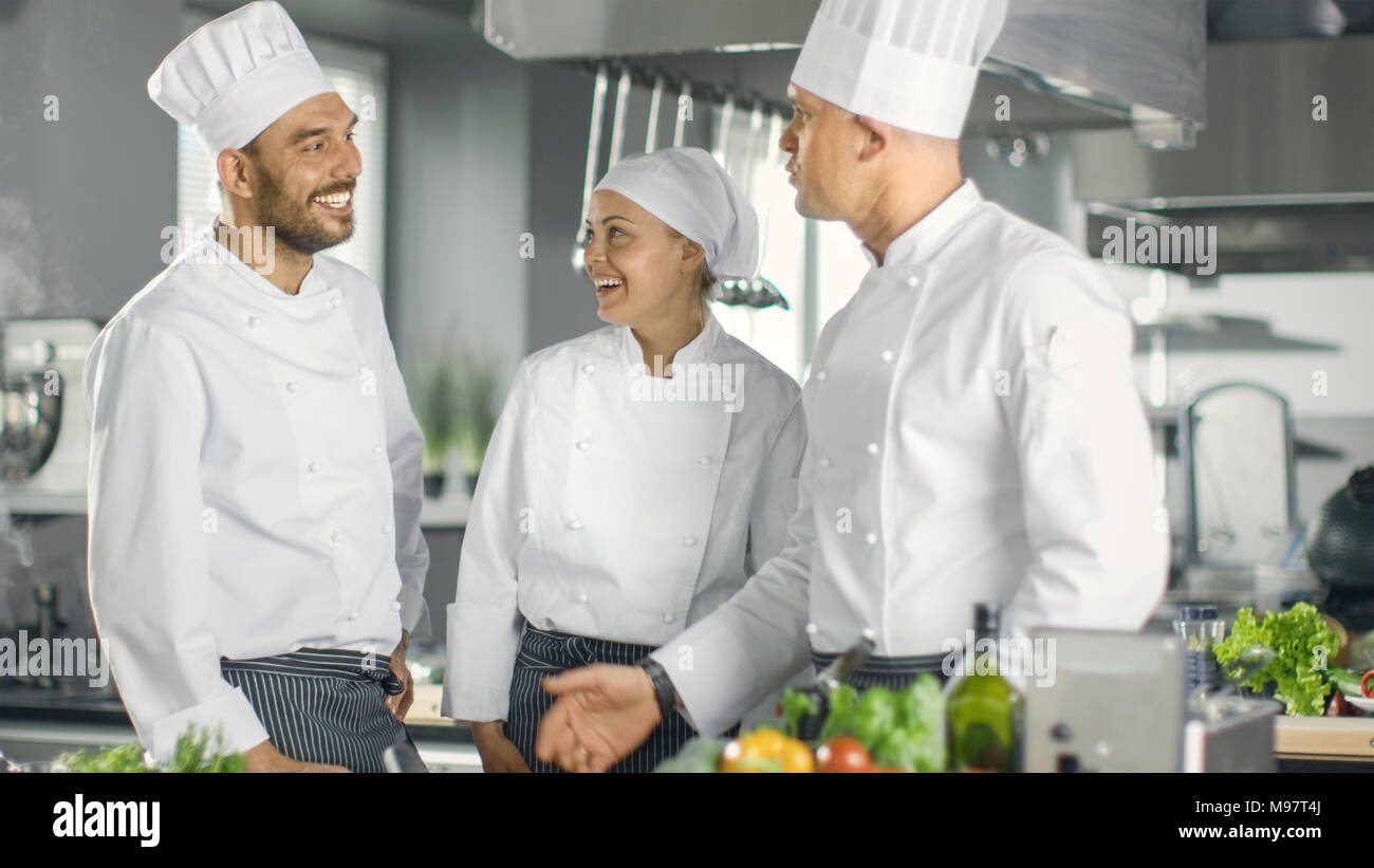 https://c8.alamy.com/comp/M97T4J/in-the-modern-kitchen-staff-member-have-discussion-with-chef-kitchen-is-full-of-food-ingredients-vegetables-meat-boiling-soup-M97T4J.jpg