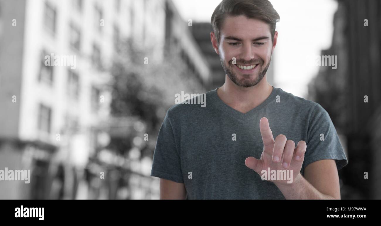 Man touching air in city Stock Photo