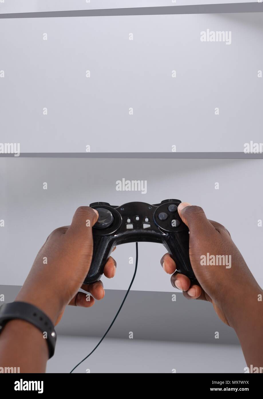 Hands holding gaming controller Stock Photo Alamy