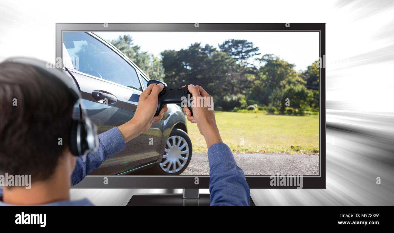 Man playing car driving computer game with controller in hands Stock Photo