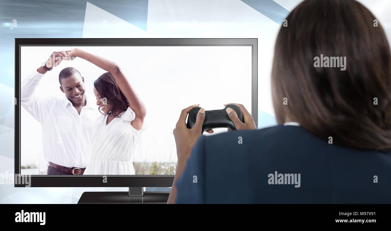 Woman playing ideal romance computer game with controller in hands Stock Photo