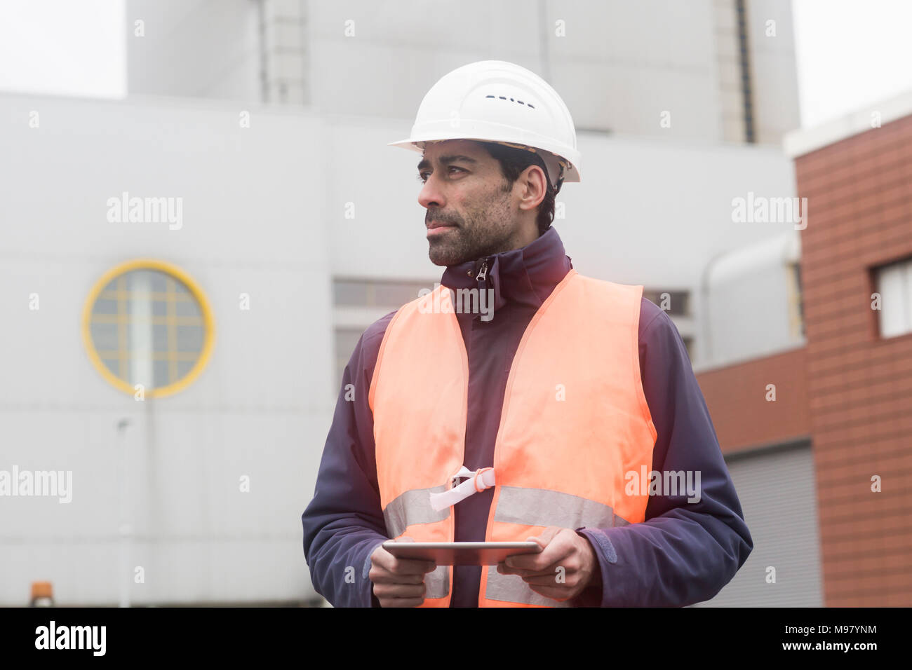 Worker wearing hard hat using hi-res stock photography and images - Alamy