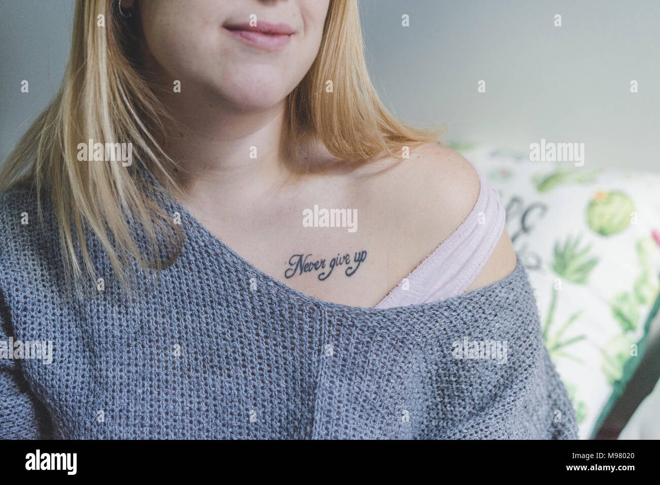 Woman with tattoo, partial view Stock Photo