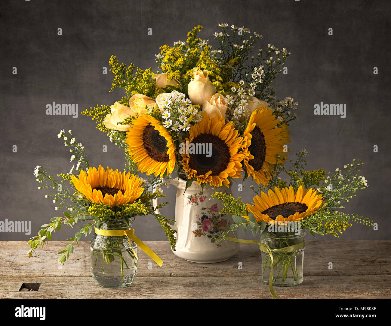 Sunflowers In Antique Jug And Jam Jars Stock Photo 177811439 Alamy