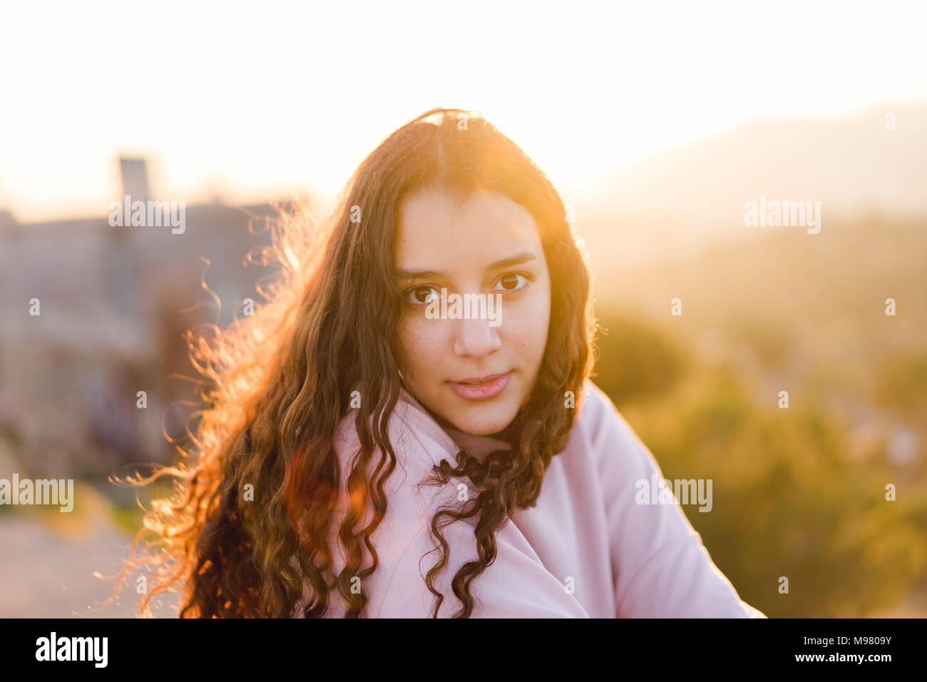 Woman with long curly hair hi-res stock photography and images - Alamy