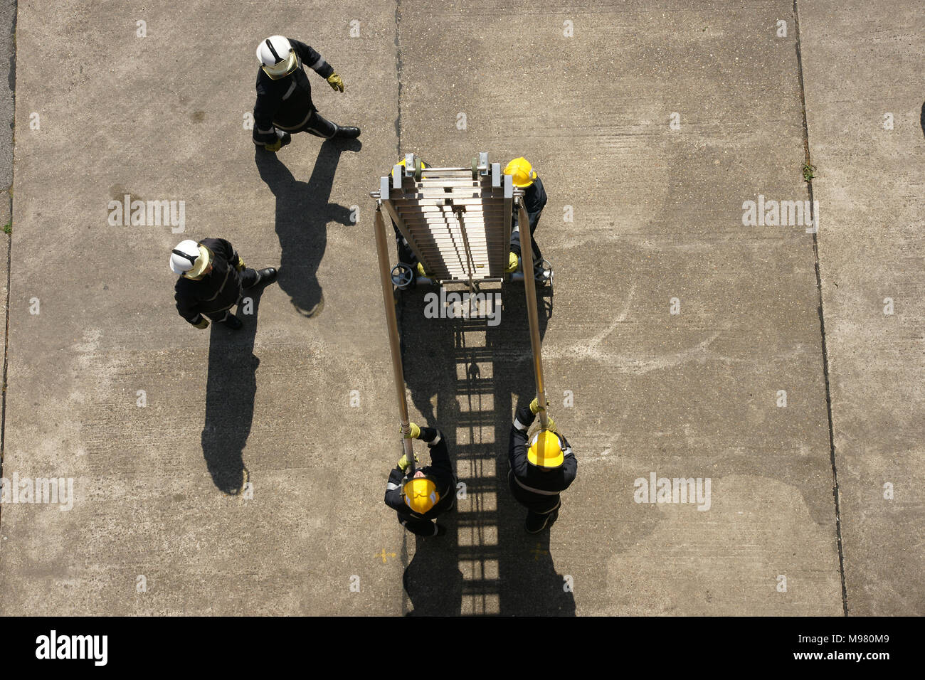 fire-fighter working at hight, 13.5m Ladder Stock Photo