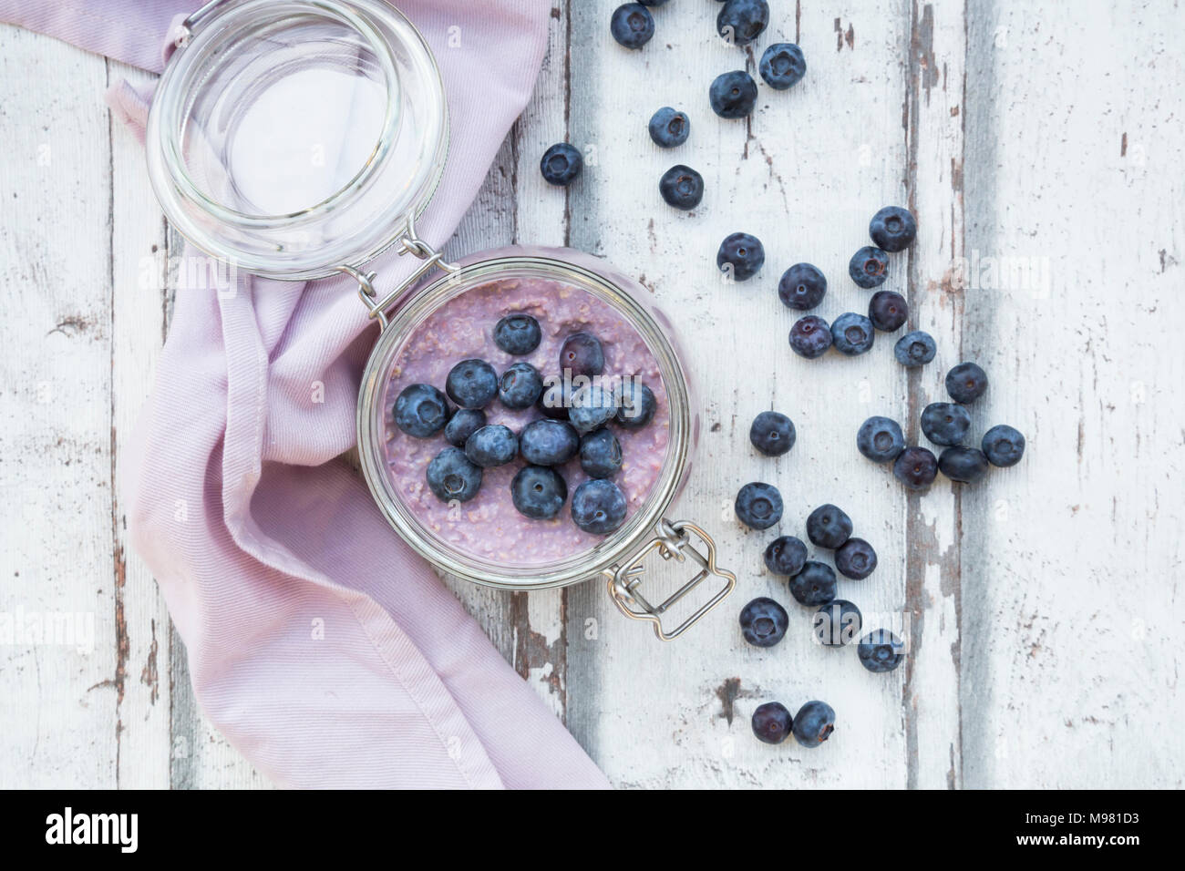 Overnight oats  with blueberries in jar Stock Photo