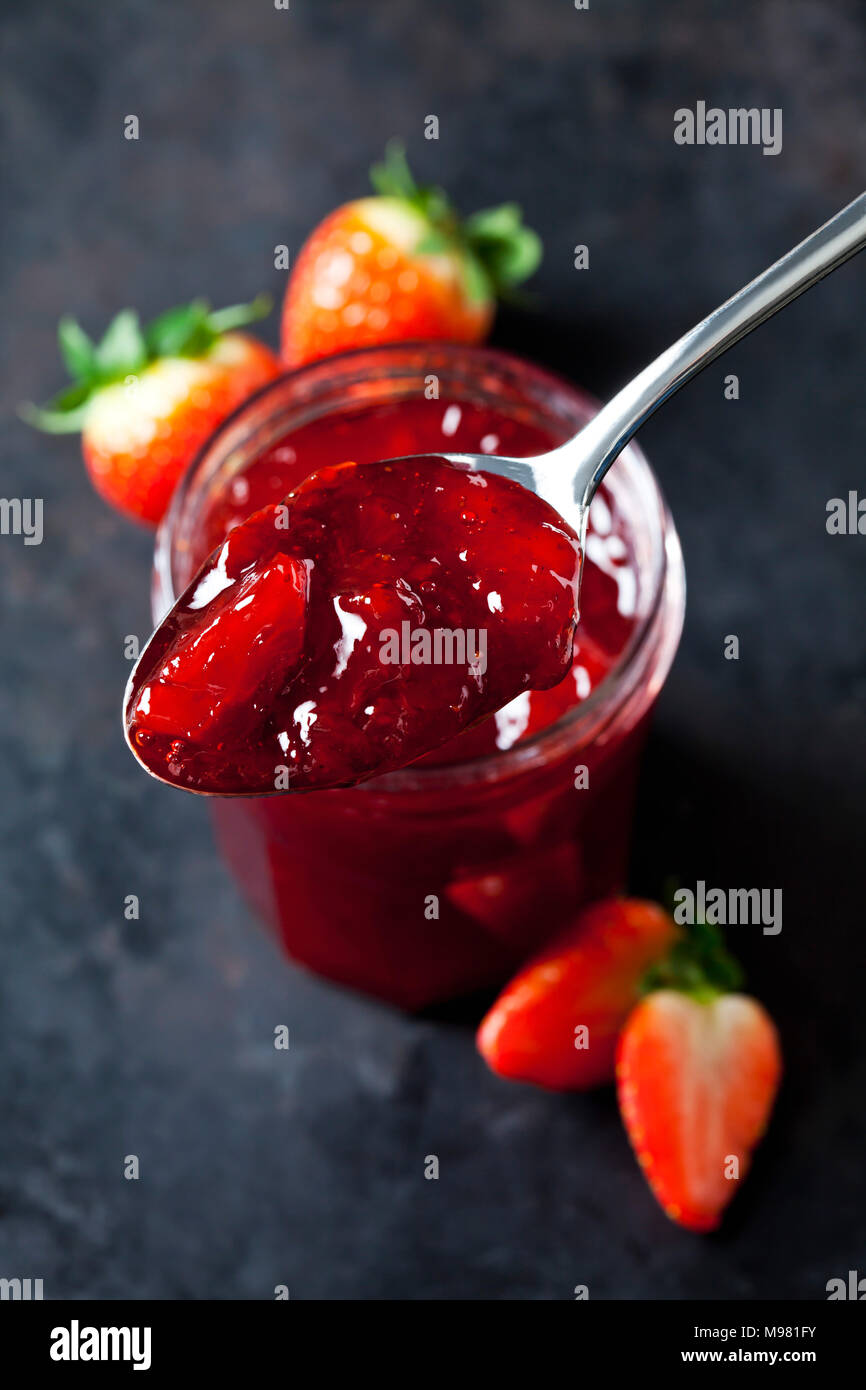 Spoon of strawberry jam, close-up Stock Photo