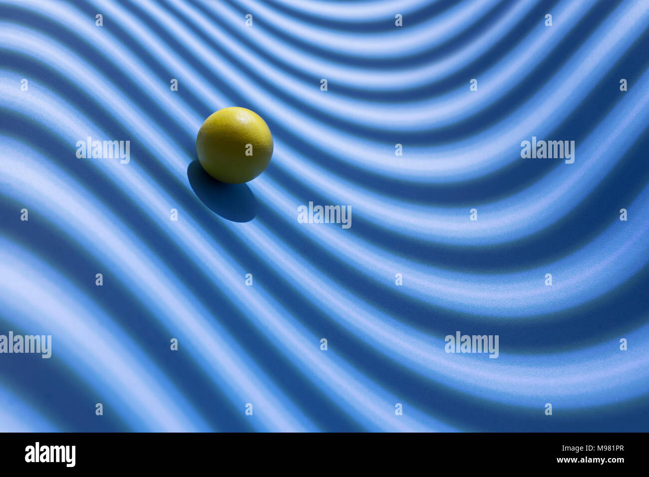 Yellow sphere over a geometric blue background, 3D Rendering Stock Photo