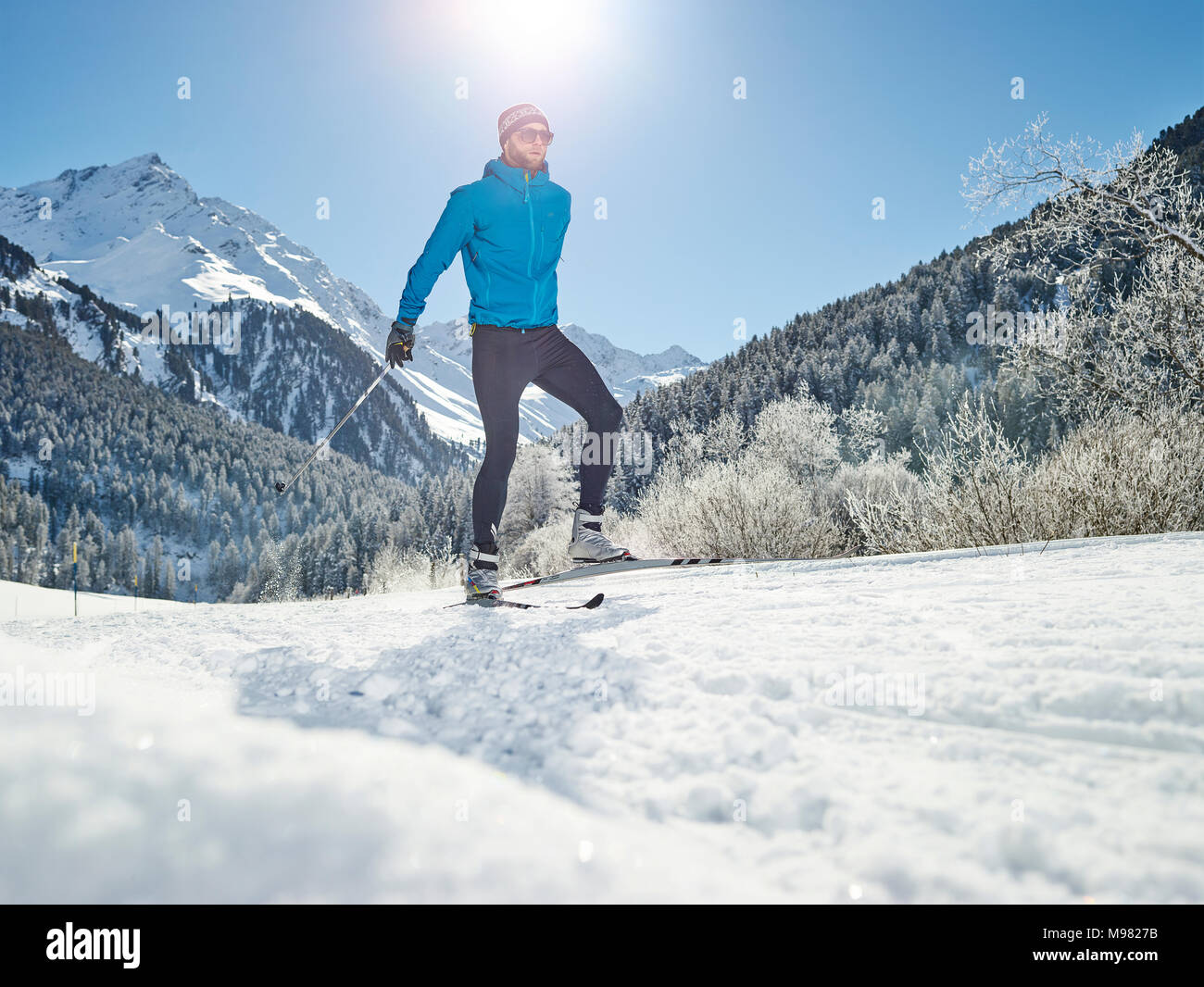Austria, Tyrol, Luesens, Sellrain, cross-country skier in snow-covered landscape Stock Photo