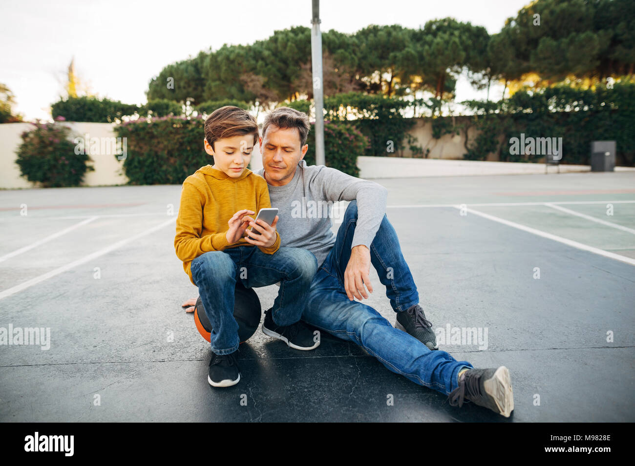 Mature father and son sitting hi-res stock photography and images - Alamy