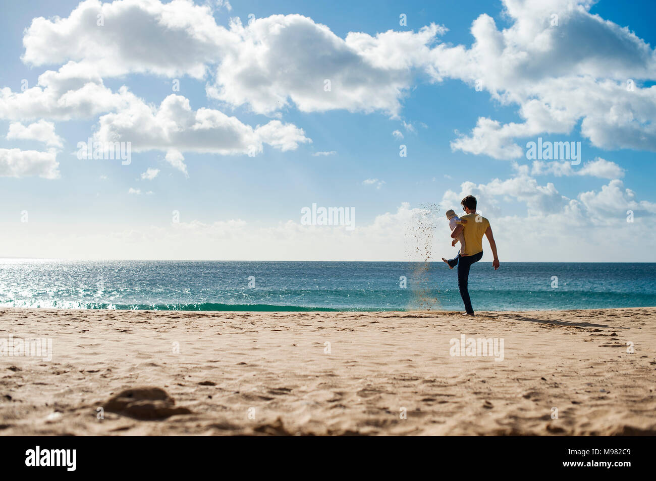 Spain, Lanzarote, father with baby girl on the beach Stock Photo