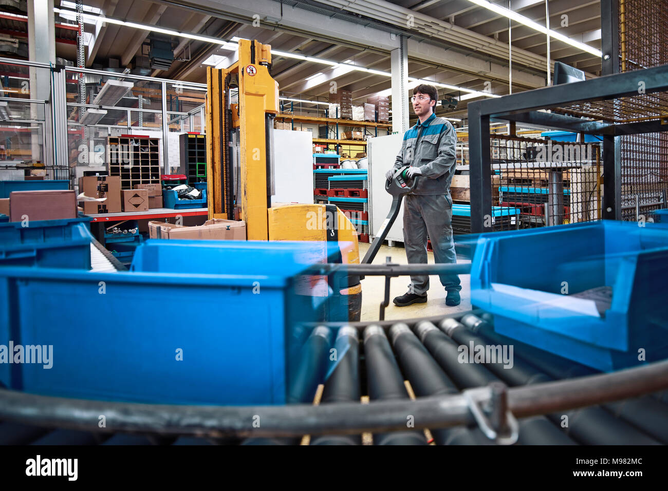 Man At Work In Factory With Boxes On Conveyor Belt Stock Photo Alamy ...