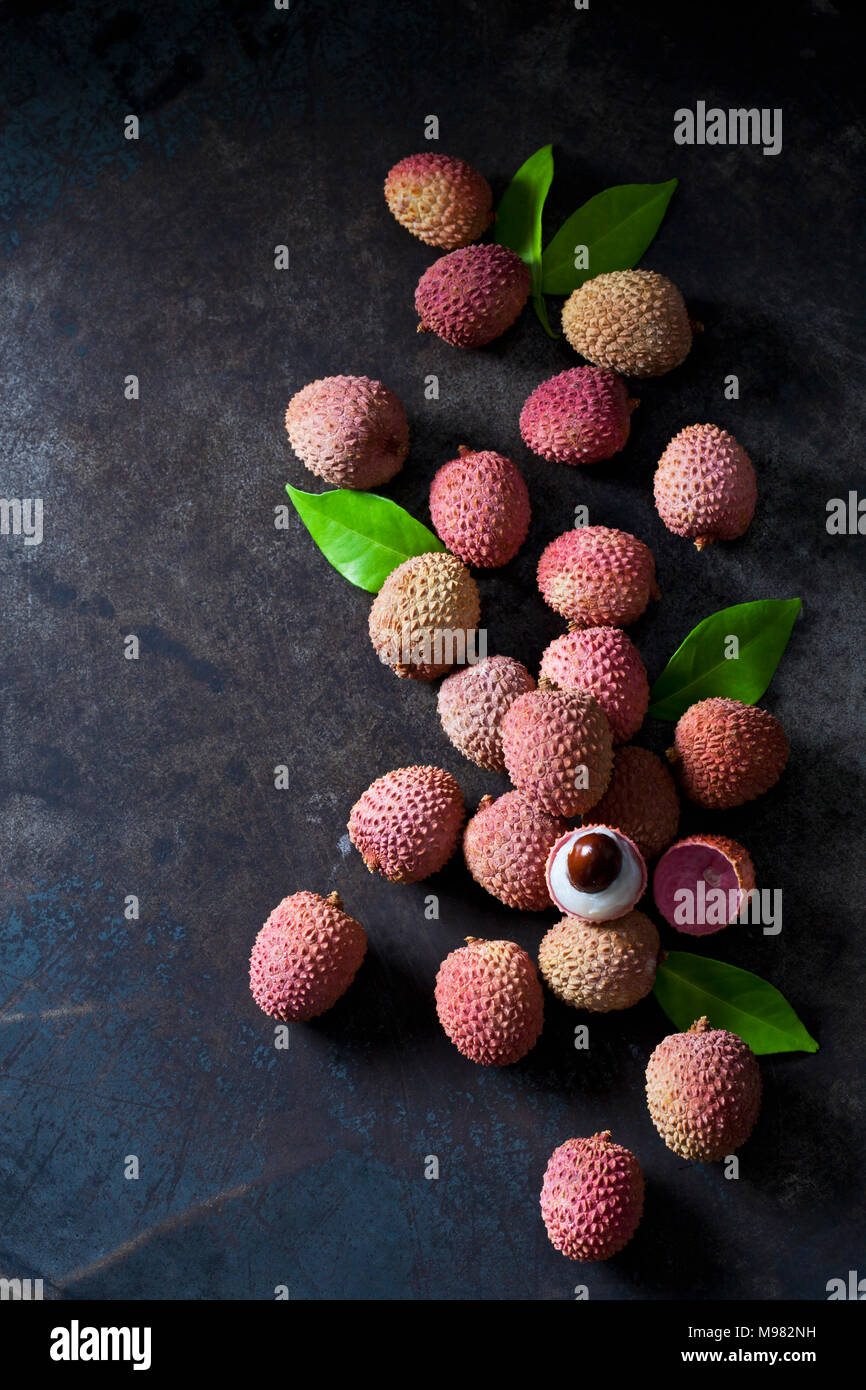 Whole and peeled lychee Stock Photo