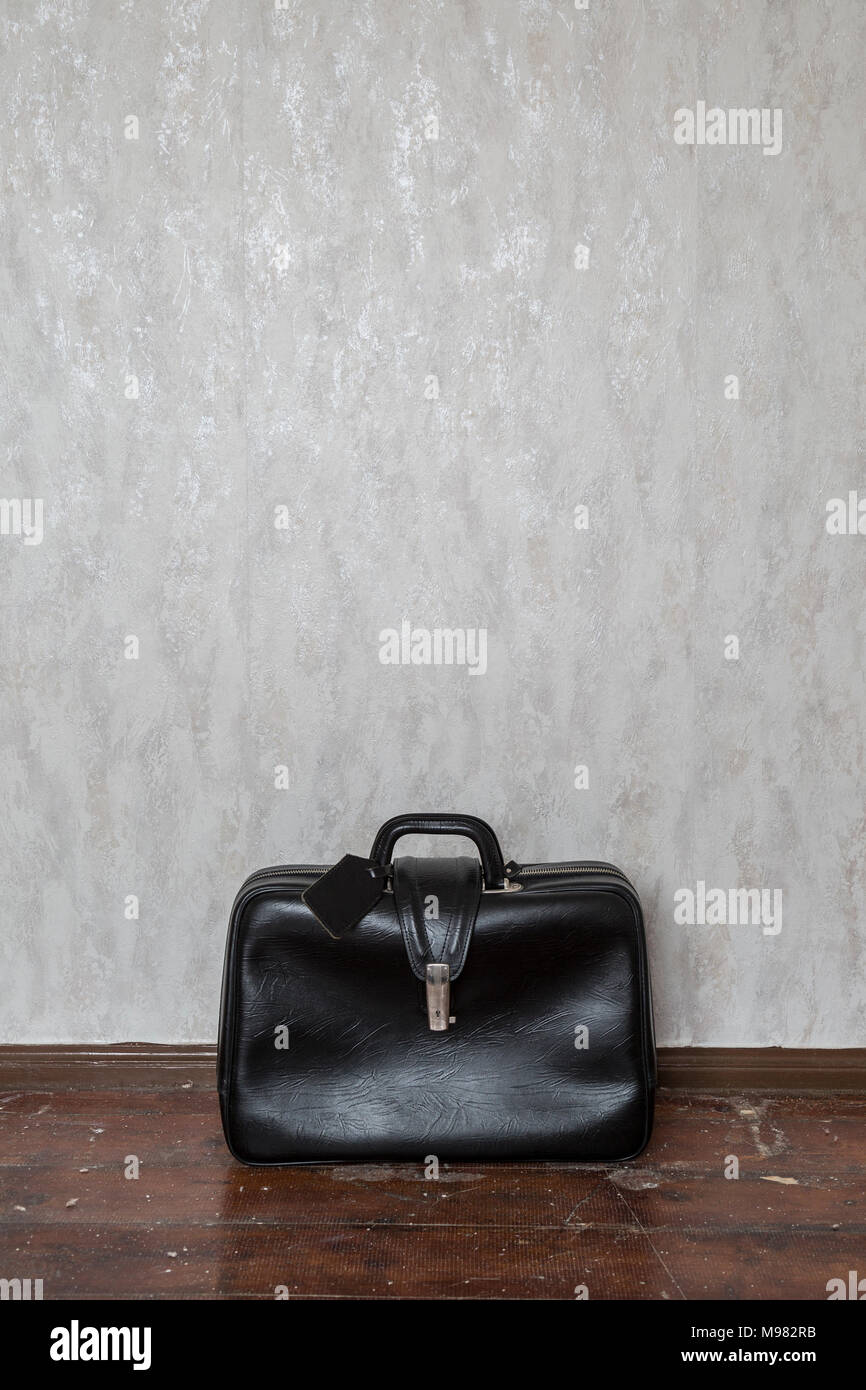 Oldfashioned black travel bag Stock Photo Alamy