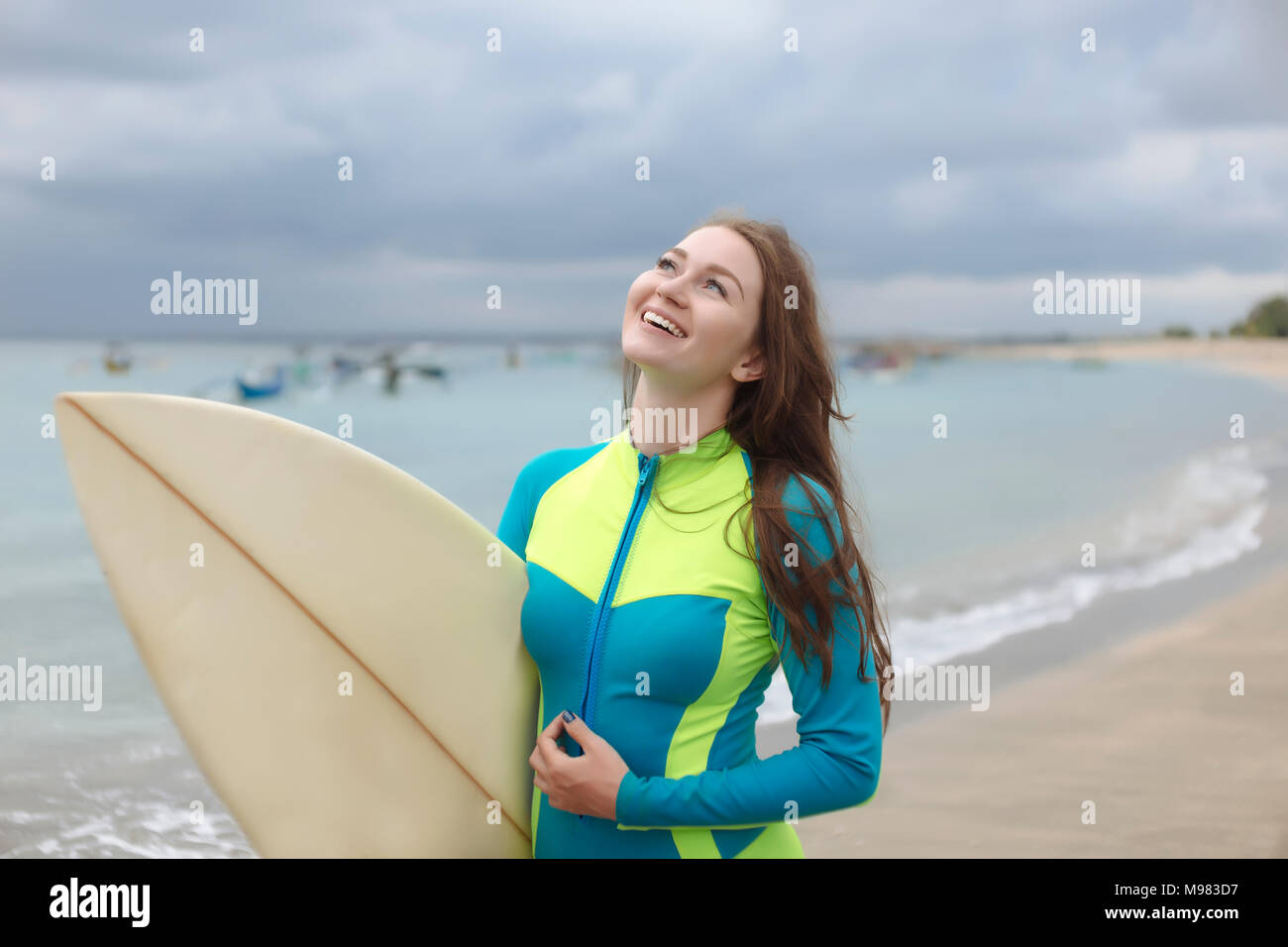 Woman on a surf board hi-res stock photography and images - Alamy