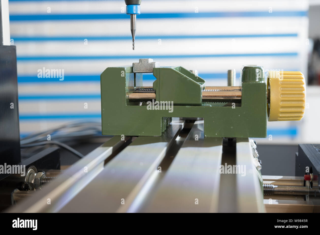 Processing of the plastic workpiece on CNC milling machine Stock Photo