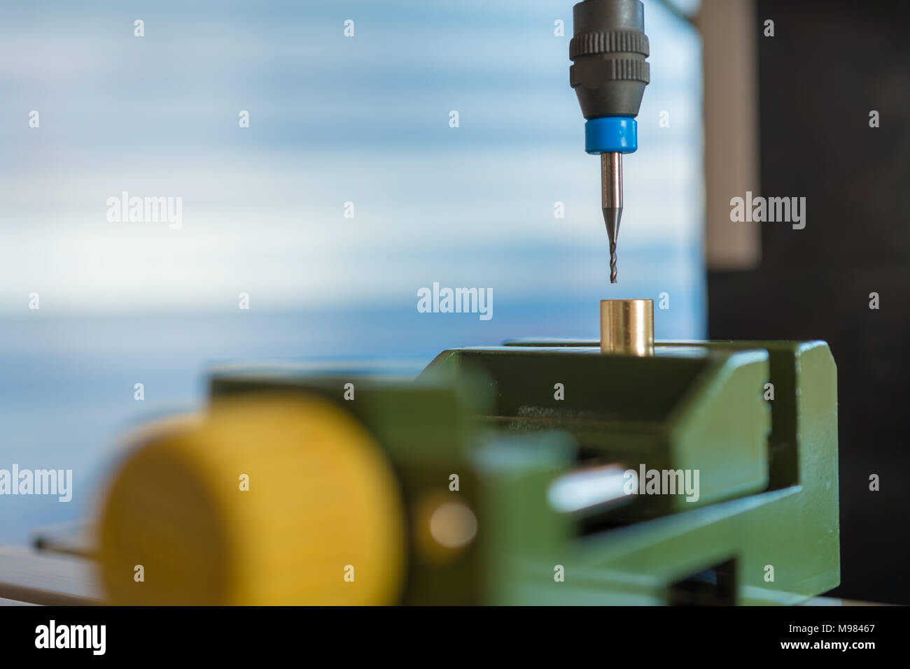 Processing of the plastic workpiece on CNC milling machine Stock Photo