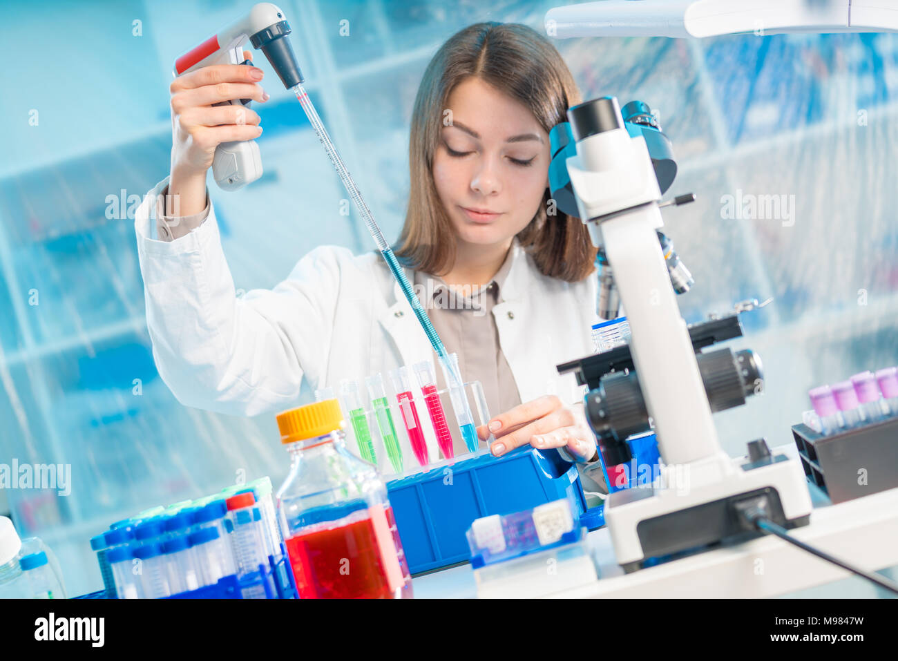 Chemist woman test tubes hi-res stock photography and images - Alamy