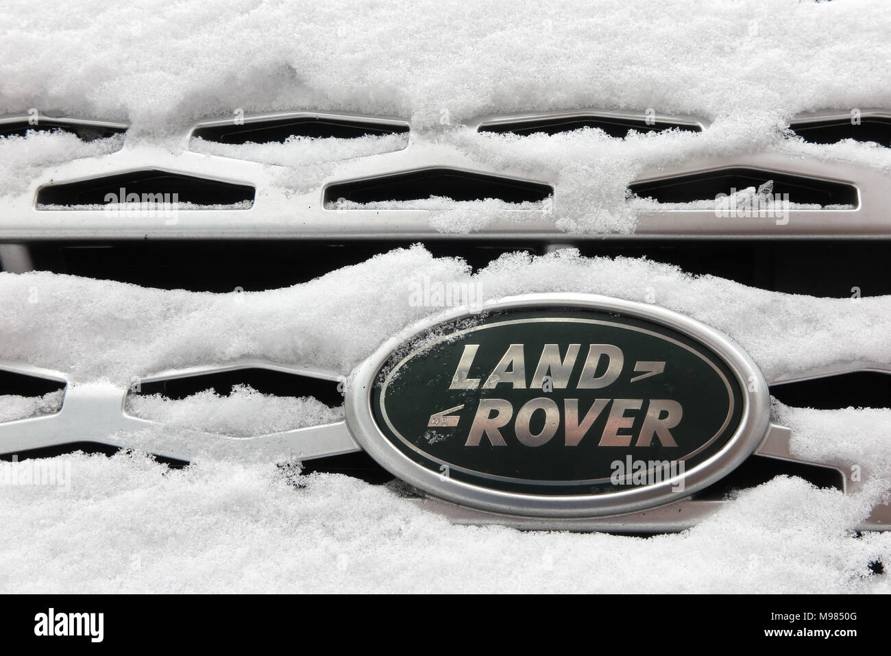 Snow covered Land Rover badge Stock Photo