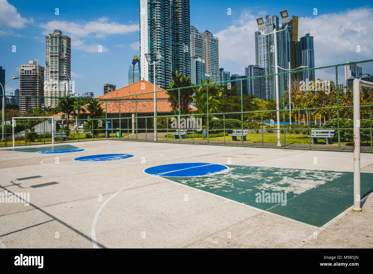 sports field, basketball court with city background - Stock Photo