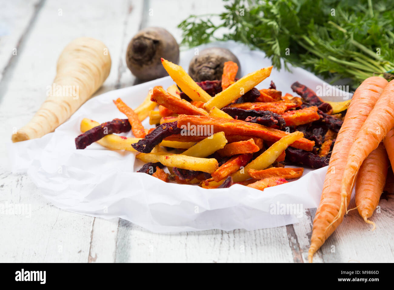 Sweet potato, carrot and parsnip fries Stock Photo Alamy