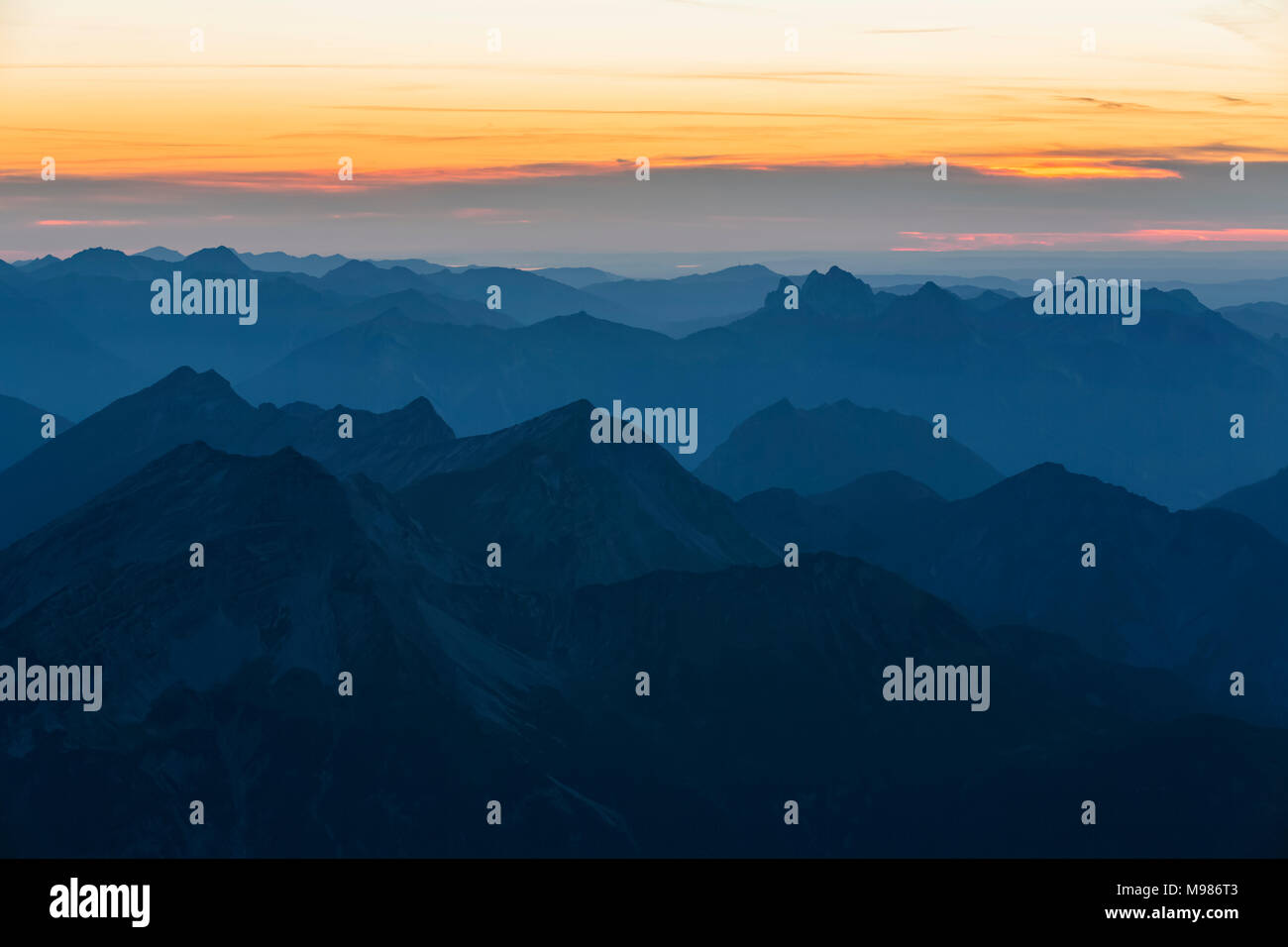 Austria, Germany, Bavaria, Zugspitze, summits at sunset Stock Photo
