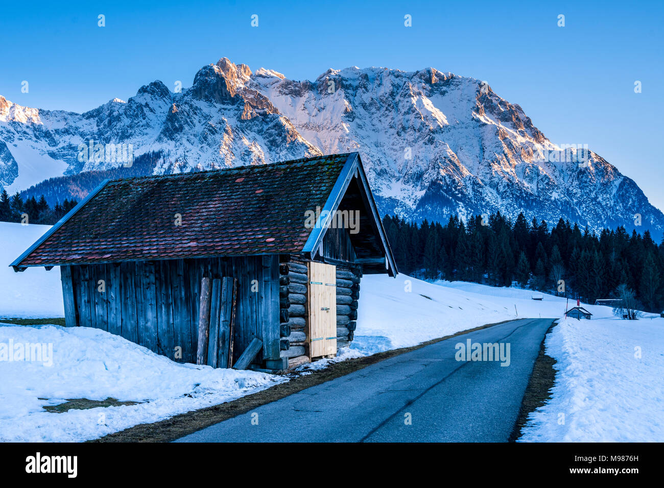 Germany, Bavaria, Upper Bavaria, Garmisch-Partenkirchen, Werdenfelser Land, barn at road Stock Photo