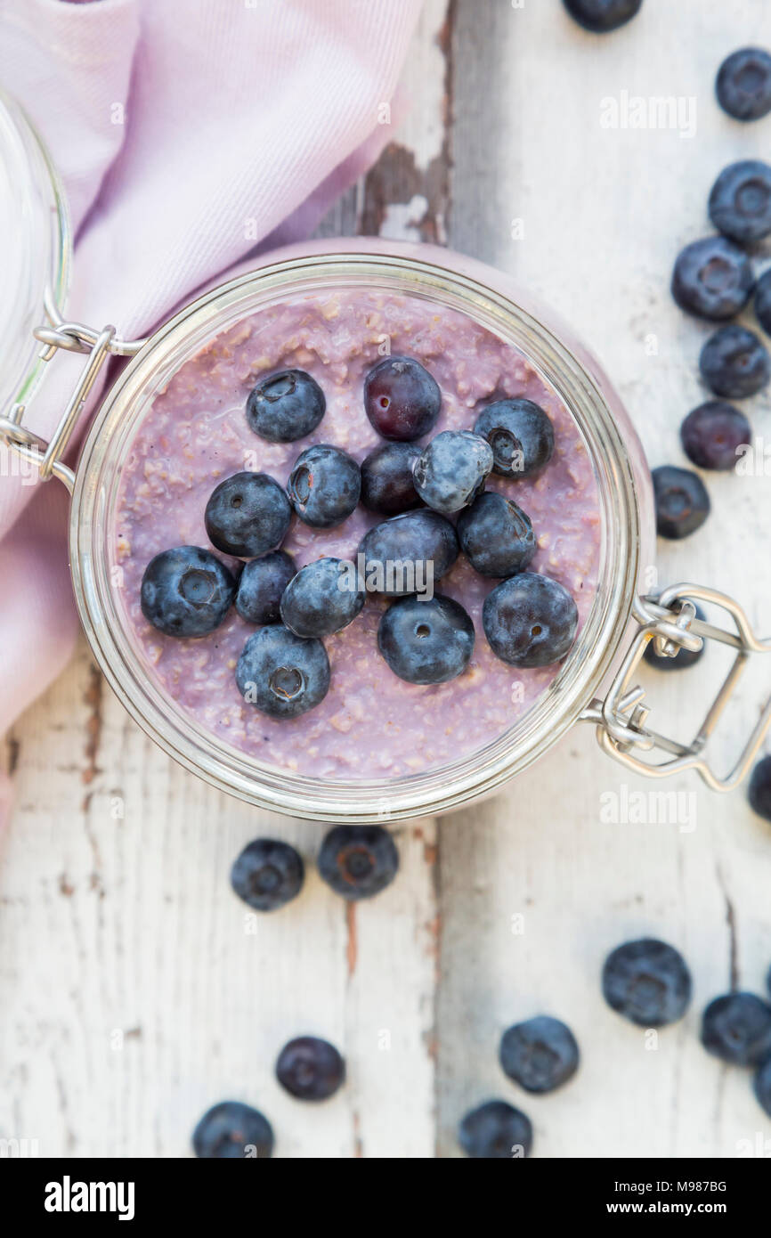 Overnight oats  with blueberries in jar Stock Photo