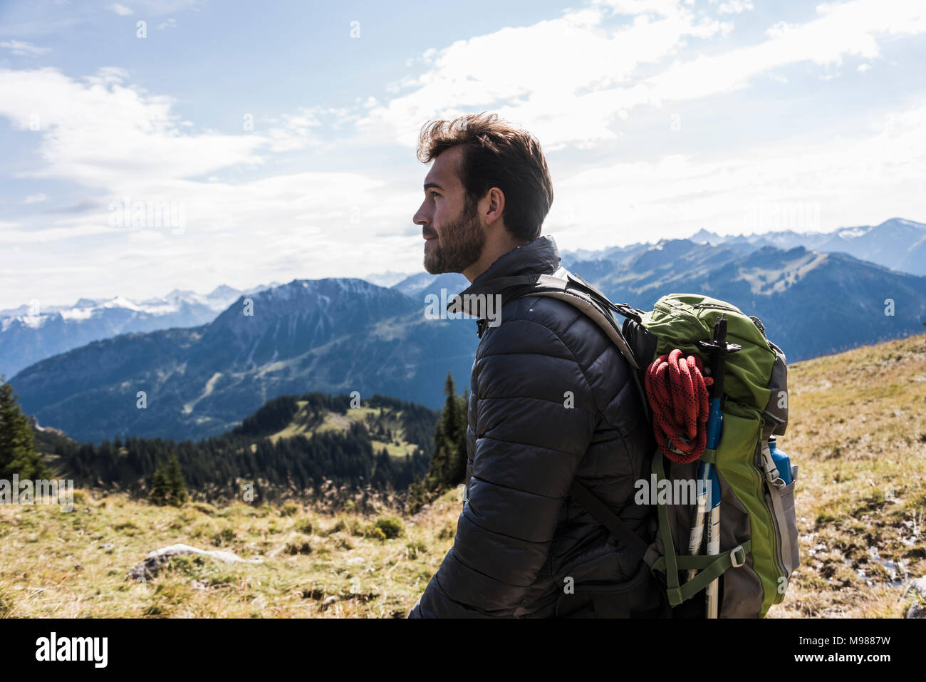 Austria, Tyrol, young man in mountainscape looking at view Stock Photo