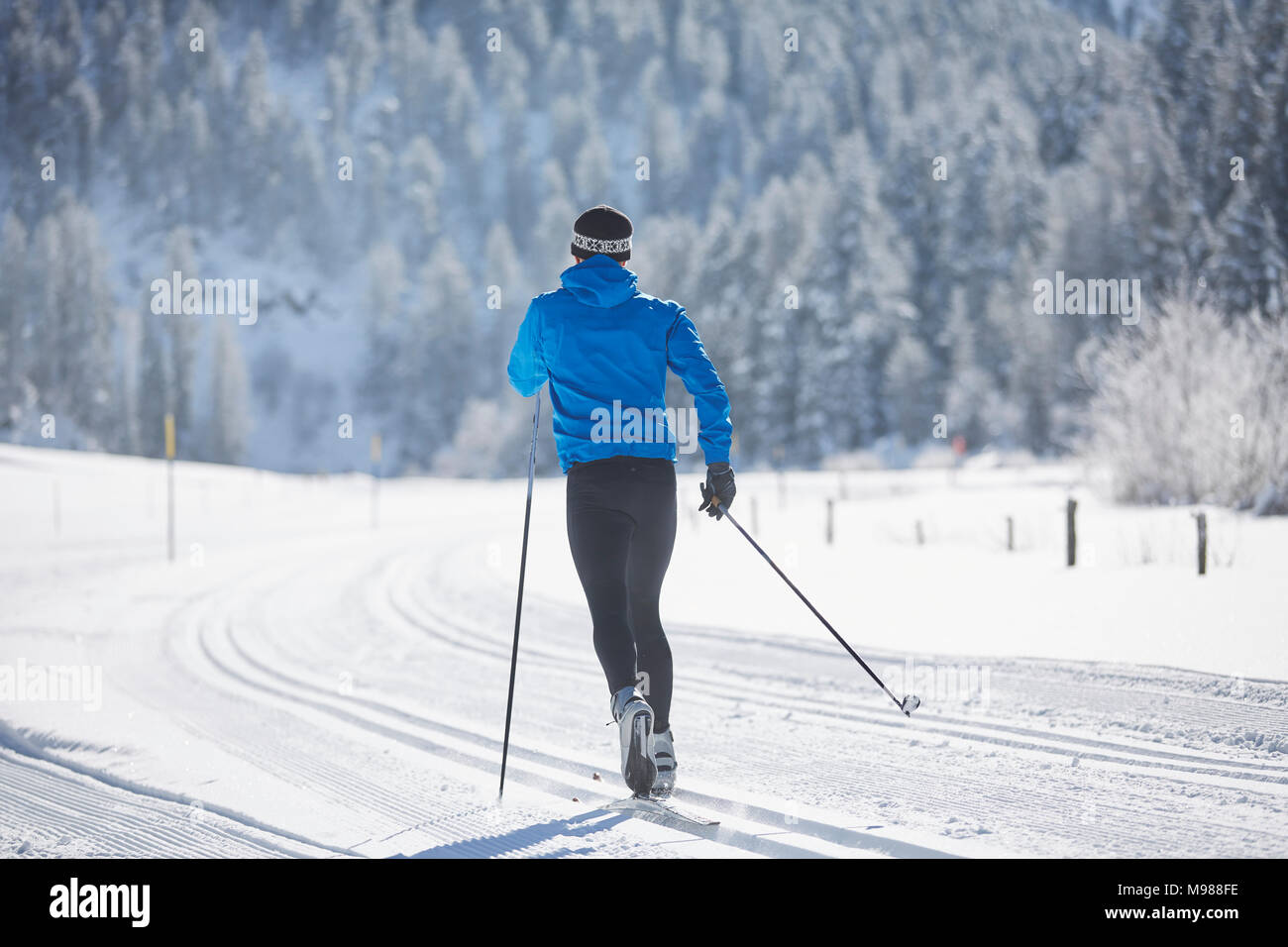 Austria, Tyrol, Luesens, Sellrain, cross-country skier in loipe in snow-covered landscape Stock Photo